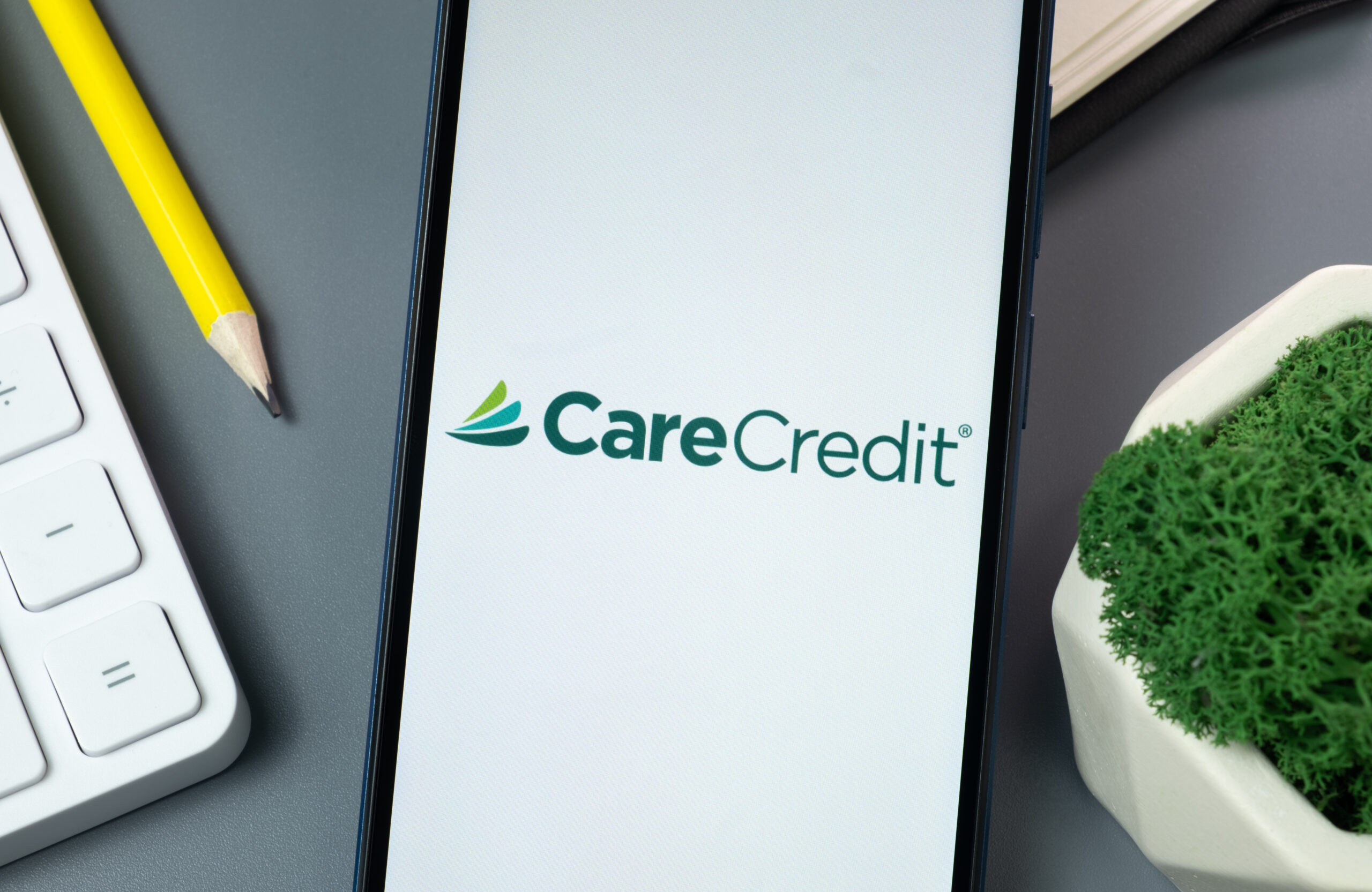New York, USA - 30 August 2024: CareCredit Logo on Phone Screen, Company Icon on Display.